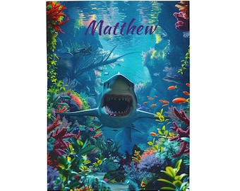 May include: A colorful underwater scene with a large great white shark swimming towards the viewer. The shark has its mouth open and its teeth are visible. The background is a vibrant blue with coral reefs and other fish. The text "Matthew" is written in purple at the top of the image.
