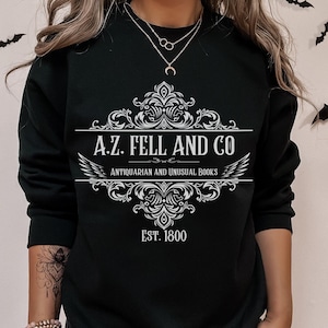 Good Omens Sweatshirt: A.Z. Fell Antiquities Graphic Sweater