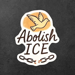 May include: A sticker with the words "Abolish ICE" in brown script. A yellow dove flies above the text, and a broken chain is at the bottom. The sticker has a white border and is set against a dark gray background.
