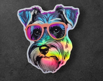 Peut inclure: Un autocollant holographique d'un schnauzer portant des lunettes de soleil roses. La fourrure du chien est irisée et les lunettes de soleil ont un effet arc-en-ciel.