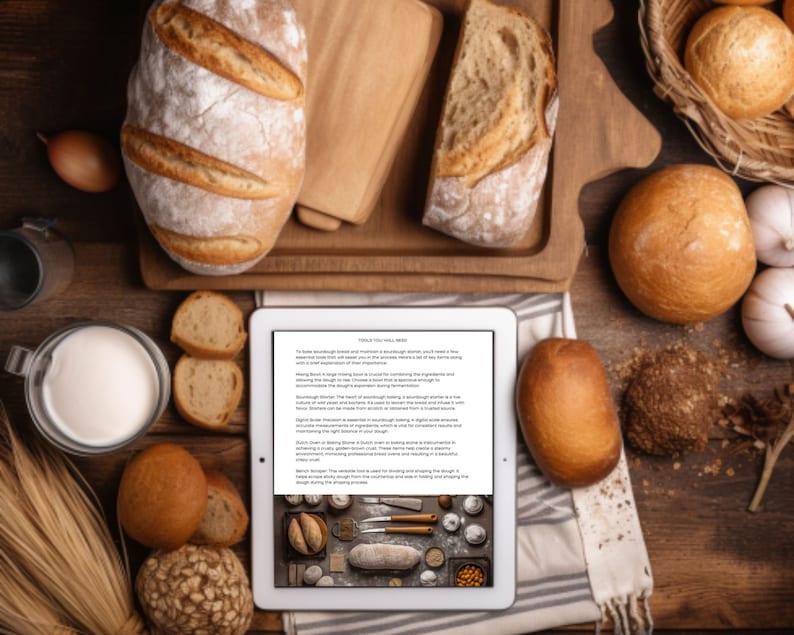 May include: A white tablet with a text about sourdough bread baking tools and techniques. The tablet is surrounded by various loaves of bread, a bowl of milk, and a basket of bread rolls on a wooden surface.