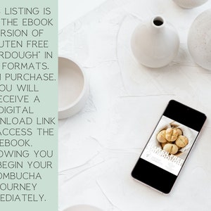 May include: A white smartphone displaying a digital download link for an ebook titled "Gluten Free Sourdough: Ancient Ingredients". The ebook cover features a close-up of several sourdough rolls in a basket.