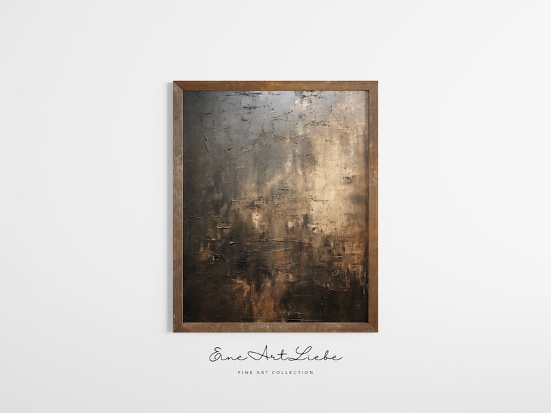 May include: A framed abstract painting with a dark brown and gold color scheme. The painting has a textured surface and is framed in a dark wood frame. The text "Eine Art Liebe" is printed below the painting.