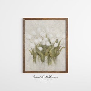 May include: A framed painting of white flowers with green stems on a textured background. The painting is in a brown frame and has the text "Eine Art Liebe" and "Fine Art Collection" below the image.