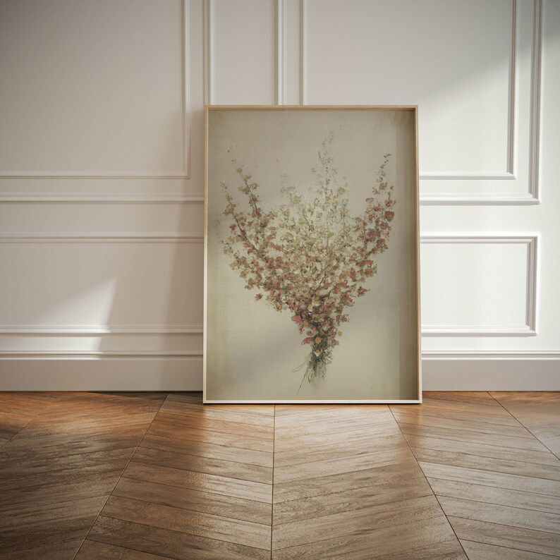 May include: A framed print of a bouquet of dried flowers in shades of brown, beige, and white. The flowers are arranged in a loose, natural style, and the background is a soft, muted beige.