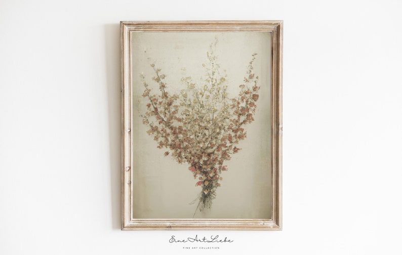 May include: A framed print of a dried flower bouquet in shades of brown, beige, and pink. The bouquet is arranged in a vase-like shape and is set against a light beige background. The frame is a simple, light wood.