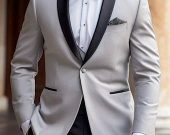 Traje gris de corte ajustado: Traje de dos piezas para la fiesta de bodas del novio.