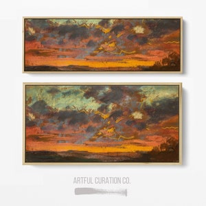 Puede incluir: Dos pinturas de paisaje rectangulares en marcos de madera clara que muestran una puesta de sol con nubes de color p&uacute;rpura oscuro, naranja y amarillo sobre un horizonte oscuro. El texto ARTFUL CURATION CO. aparece en gris debajo de las pinturas.