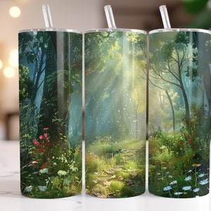 May include: Three stainless steel tumblers with a forest scene design. The tumblers feature a path through a lush green forest with sunlight streaming through the trees. The design includes flowers and foliage in shades of green, blue, and red.