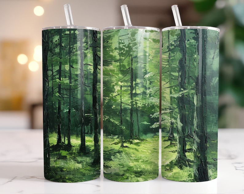 May include: Three stainless steel tumblers with a green forest scene painted on them. The tumblers have lids and straws.
