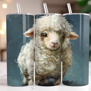 May include: Three stainless steel tumblers with a white fluffy lamb illustration. The lamb has brown eyes and a white muzzle. The tumblers have a blue background.