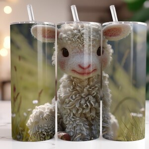 May include: A white fluffy lamb with brown eyes and a pink nose is looking directly at the camera. The lamb is sitting in a field of green grass with white flowers.
