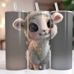 May include: Three stainless steel tumblers with a white lamb with big eyes and a fluffy coat on the front. The tumblers are gray and have a gradient effect.