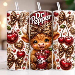 May include: A cylindrical tumbler with a clear straw featuring a pattern of Dr Pepper logos, a cartoon highland cow with a leopard print bow, red cherries, and leopard print bows on a white background. The cow holds a glass of soda.
