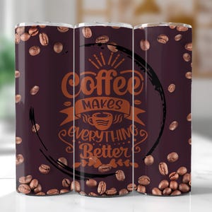 May include: Three stainless steel tumblers with a brown background and a coffee bean pattern. The tumblers have the text "Coffee makes everything better" in a copper color.