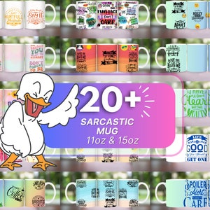May include: A collection of 20+ white ceramic mugs with sarcastic sayings printed on them. The mugs are 11 oz and 15 oz. The sayings include "Say It", "Bossy Leadership", "I Have A Good Heart But The Mouth", "Life Is Good You Should Get One", and "Spoiler Alert I Don't Care".