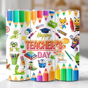 May include: Three white tumblers with colorful designs featuring pencils, crayons, and other school supplies. The middle tumbler has the text "Happy Teacher's Day" in colorful letters.