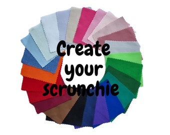 May include: A variety of fabric swatches in different colors arranged in a circle. The text "Create your scrunchie" is in the center of the circle.