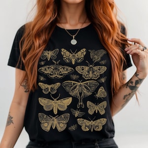 May include: Black t-shirt with a gold print of various moths and butterflies.