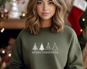 May include: A green sweatshirt with a white graphic of four stylized Christmas trees and the text "Merry Christmas".