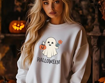 May include: White sweatshirt with a cute ghost holding a jack-o-lantern and a flower. The text "HALLOWEEN" is printed below the ghost.