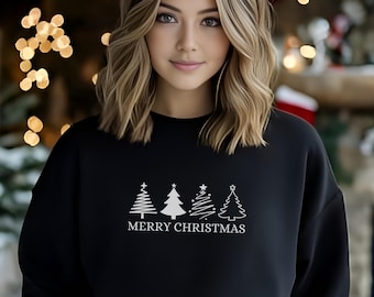 May include: A black sweatshirt with a white graphic of four stylized Christmas trees and the text "Merry Christmas".