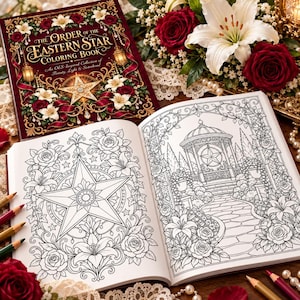May include: A colouring book titled The Order of the Eastern Star Colouring Book with a maroon cover featuring gold filigree, a star, and floral illustrations. The open book displays black and white line art of a star and a garden gazebo.