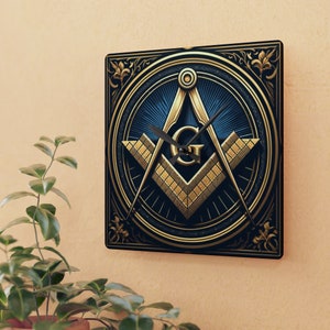 May include: A gold and blue square clock with a Masonic compass and square design. The clock face has a black background with gold accents and a gold letter "G" in the center.