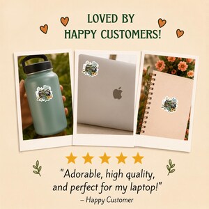 May include: A sticker featuring a vintage camera surrounded by colourful flowers and green leaves. The sticker is shown applied to a sage green water bottle, a silver laptop, and a spiral-bound notebook, with the text LOVED BY HAPPY CUSTOMERS.