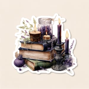 May include: A stack of three vintage books topped with a glass jar of lavender, a small candle, and a brown bowl candle. Beside the books are two tall purple candles in ornate black holders and a single purple fig, all accented with lavender sprigs.
