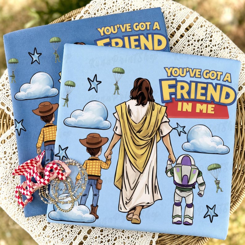 May include: Two light blue books with the text "YOU'VE GOT A FRIEND IN ME". One book features an illustration of Jesus holding hands with Woody and Buzz Lightyear. The other book has Woody, clouds, stars, and parachuters.