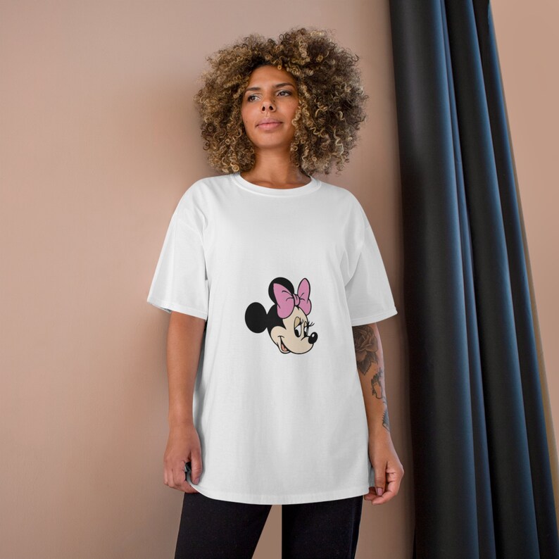 May include: White oversized t-shirt with a cartoon image of Minnie Mouse wearing a pink bow.