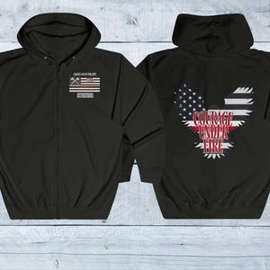 May include: Black zippered hoodie with a red, white, and blue American flag on the left chest and a red, white, and blue eagle with the text "Courage Under Fire" on the back.
