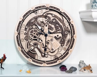 May include: A wooden clock with a detailed, intricate design of gears and cogs. The clock face is made of light wood and has Roman numeral markings. The clock hands are black.