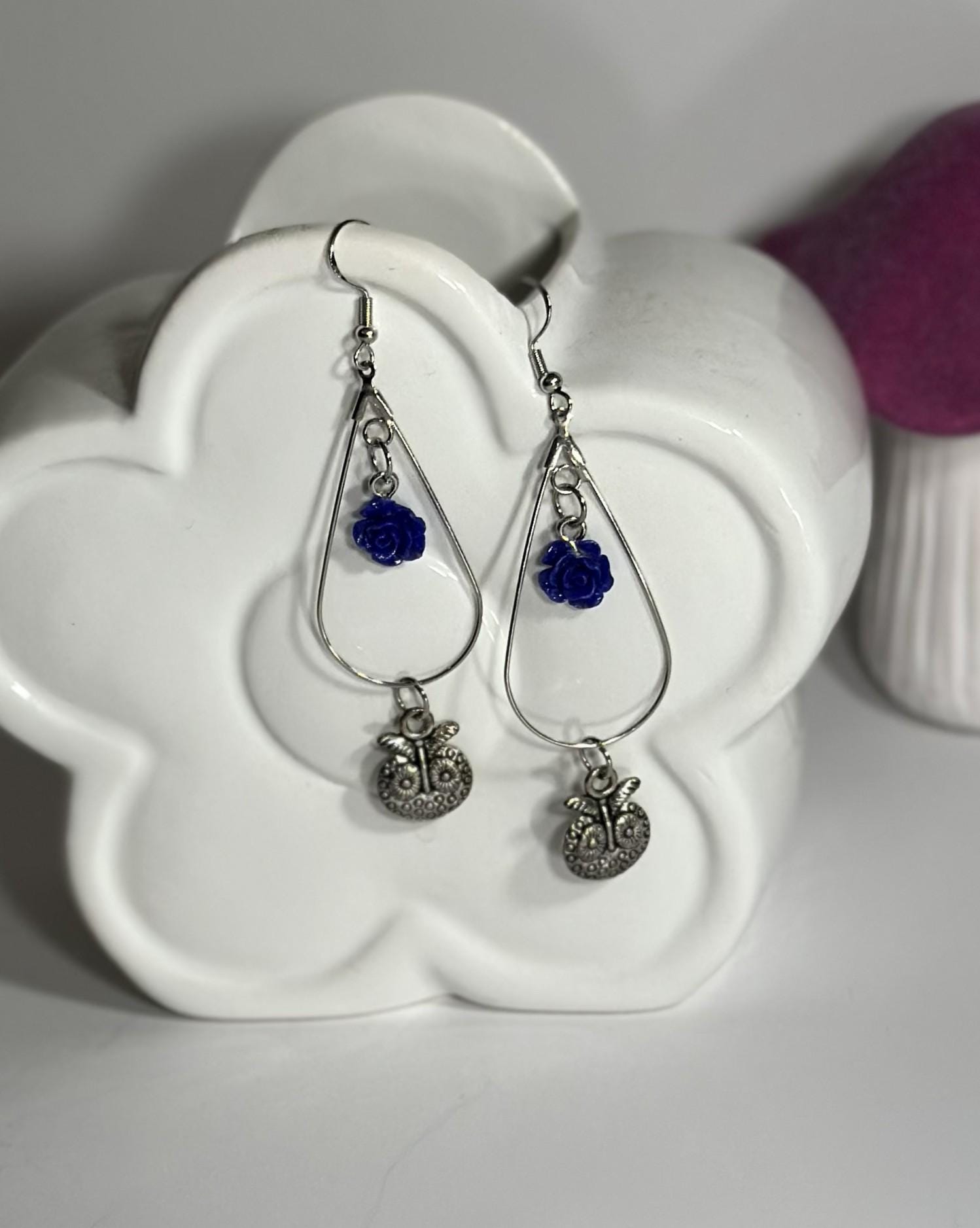 Owl charm hoop earrings featuring a blue rose bead.
