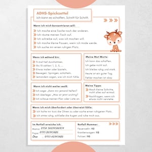 Op de afbeelding: Een bedrukt blad met Duitse tekst en een cartoon hert illustratie. Het biedt tips voor het omgaan met focus, woede en overprikkeling. Bevat noodcontacten en motiverende zinnen.