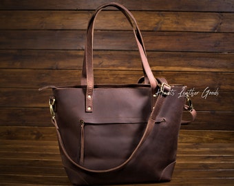 Leather tote bag for ladies. with inside laptop sleeve , key holder and removable cross body leather strap.