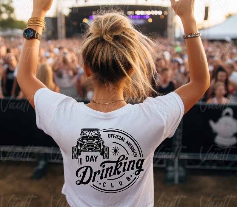 May include: A white t-shirt with a black graphic of an off-road vehicle and the text "Official Member 1 Day Drinking Club".