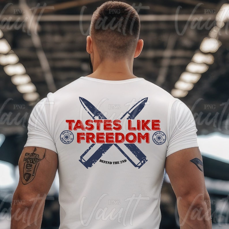 May include: White t-shirt with a red, white, and blue graphic design featuring crossed bullet casings and the text "Tastes Like Freedom" with the words "Defend the 2nd" below.