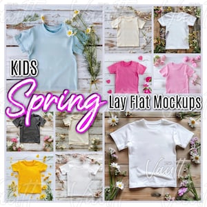 May include: A set of ten lay flat mockups of kids' t-shirts in various colors, including white, light blue, pink, yellow, and gray. The shirts are laid out on a wooden surface with flowers and greenery around them. The text "KIDS Spring Lay Flat Mockups" is displayed on the image.