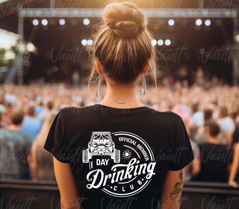 May include: A black t-shirt with a white graphic of a side-by-side vehicle and the text "1 Day Drinking Club Official Member".