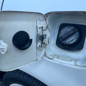 Universal Fuel Cap Holder