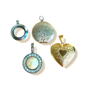 May include: Four metal pendants including a silver-tone circular floating locket, a round gold-tone locket with an etched vine pattern, a circular pendant with a central iridescent stone surrounded by clear crystals, and a gold-tone heart-shaped locket.