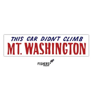 May include: White rectangular bumper sticker with the text "THIS CAR DIDN'T CLIMB MT. WASHINGTON" in blue and red lettering. The sticker also includes the "FISHERS" logo in black.