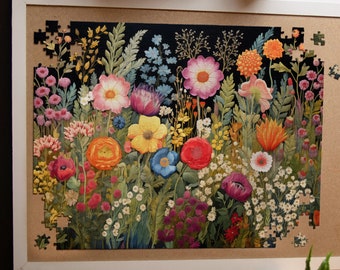 May include: A colorful floral jigsaw puzzle with a dark background. The puzzle features a variety of flowers in shades of pink, red, yellow, blue, and purple. The flowers are arranged in a random pattern, creating a visually appealing design.