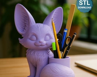 May include: A lavender fox-shaped desk organizer holding pens, pencils, and scissors. The fox has large ears and a smiling face. The organizer is on a wooden surface. The image includes the text "STL DOWNLOAD" in a blue circle.