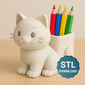 May include: A cream-coloured cat-shaped pencil holder containing red, blue, yellow, and green pencils. The holder has a smiling face and a tail. A blue badge with "STL DOWNLOAD" is visible.