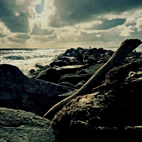 Golden Sun on Big Rocks and Ocean Jetty