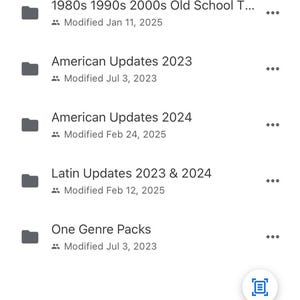 May include: Screenshot of a mobile phone screen displaying a file manager app with a list of folders. The folders are named "1980s 1990s 2000s Old School T...", "American Updates 2023", "American Updates 2024", "Latin Updates 2023 & 2024", and "One Genre Packs". The folders are arranged by date modified, with the most recently modified folder at the top of the list.
