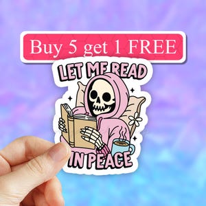 May include: A sticker with a pink-hooded skeleton reading a book and holding a cup of coffee. The text reads "Let me read in peace".
